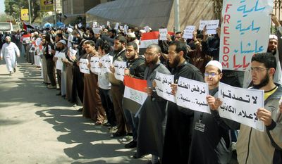 Ultraconservative Muslims from the Salafi movement staged a protest in Cairo on Tuesday, accusing the local Christian church of abducting a Muslim convert. The protest came amid signs of increasing assertiveness by the fundamentalist movement. The signs in Arabic read: &quot;dont believe false media&quot; and &quot;we reject the aggression.&quot; (Associated Press)