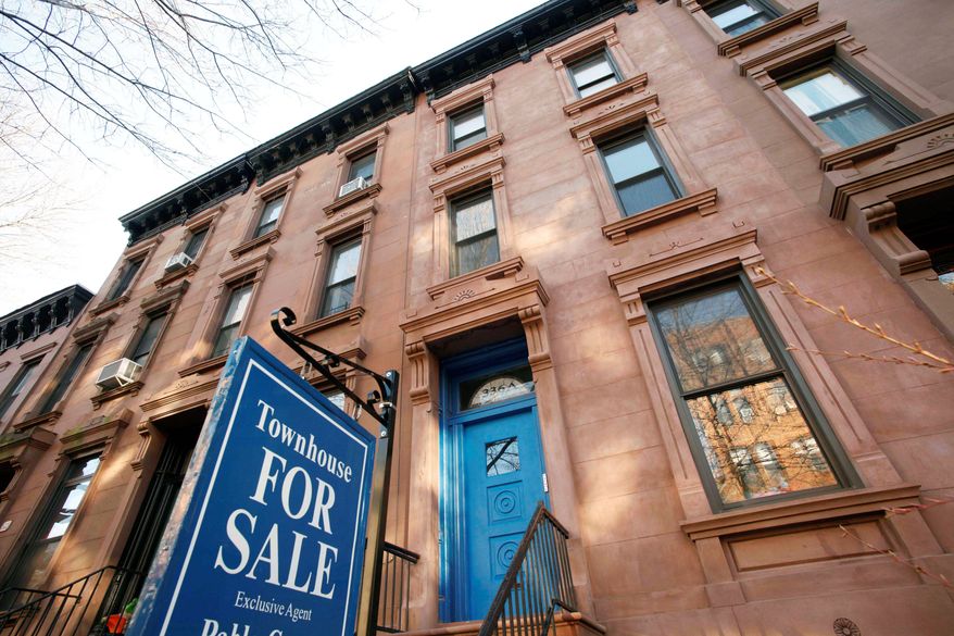 A town house is for sale in Brooklyn, N.Y. Housing prices fell in 19 of 20 large cities and 0.22 percent overall in January, according to the S&P/Case-Shiller index released Tuesday. Washington was the only city in which prices rose. Prices have fallen 3 percent in the past year. (Associated Press)