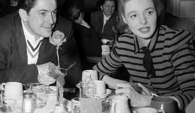 ** FILE ** In a Feb. 29, 1948, file photo, Patricia Neal is shown at lunch with actor Farley Granger on the studio lot in Los Angeles. Granger, most famous for his roles in Alfred Hitchcock's "Strangers on a Train" and "Rope," died Sunday, March 27, 2011, of natural causes in New York. He was 85. (AP Photo, File)