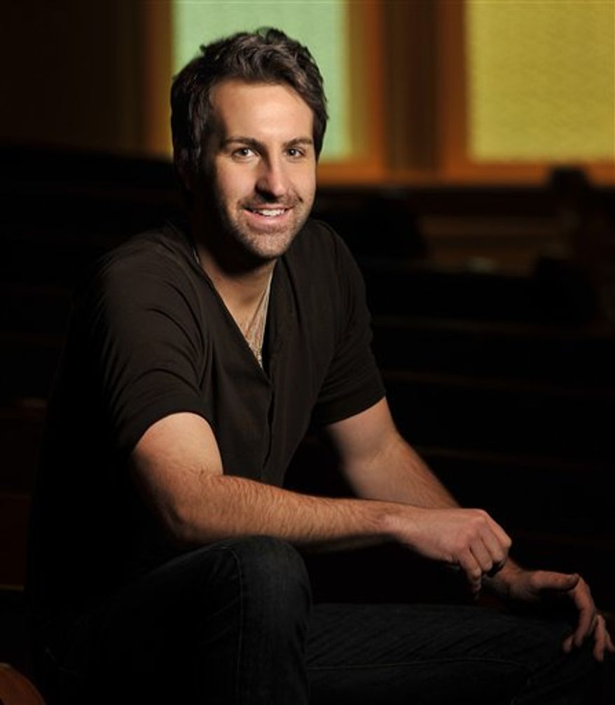 In this Feb. 8, 2011 photo, singer-songwriter Josh Kelley poses for photos at the Ryman Auditorium in Nashville, Tenn. (AP Photo/Donn Jones)