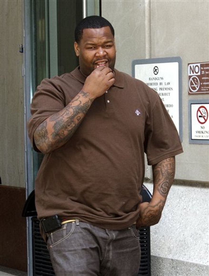 FILE - This June 4, 2010, file photo shows Green Bay Packers defensive lineman Johnny Jolly leaving the Harris County Criminal Court Building after a hearing related to his charge of possession of codeine, in Houston. Jolly is scheduled to appear in court Wednesday morning March 30, 2011 to hear the two counts of possession of a controlled substance. He has remained in the Harris County Jail since his arrest early Friday. (AP Photo/Bob Levey, File)