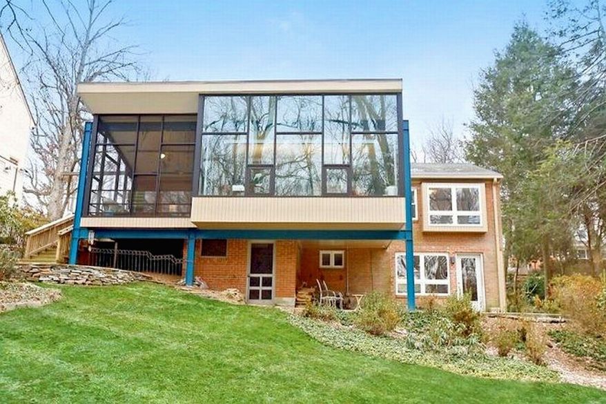 The owners expanded the home in 2009 with a large glass-enclosed addition. Instead of building a foundation for the addition, the owners suspended it on steel beams.