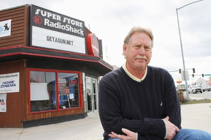 Steve Strand, who owns a RadioShack outlet in Hamilton, Mont., says he will defy RadioShack corporate officials' insistence that he halt a free-gun promotion with satellite television subscriptions, in effect since October. (Associated Press)