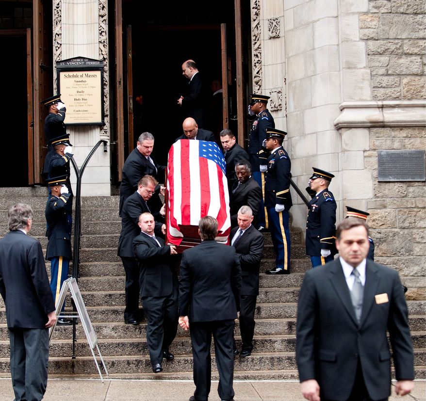Former vice-presidential candidate Geraldine Ferraro's casket is carried out of the Church of Saint Vincent Ferrer later Thursday. Mrs. Ferraro, 75, died Saturday of multiple myeloma, a form of blood cancer. (Associated Press)