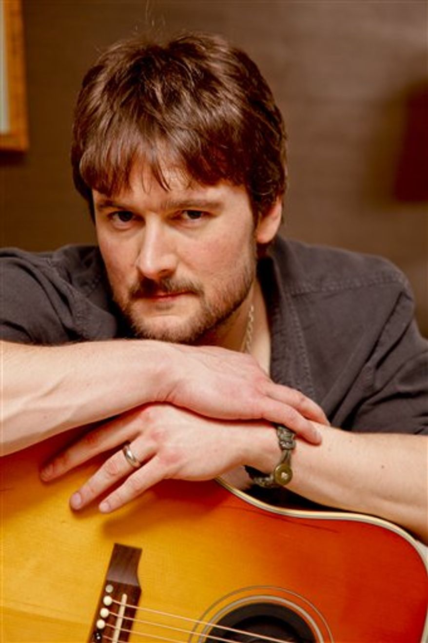 In this March 18, 2011 photo, country singer Eric Church performs at the Grand Ole Opry in Nashville, Tenn. (AP Photo/Ed Rode)