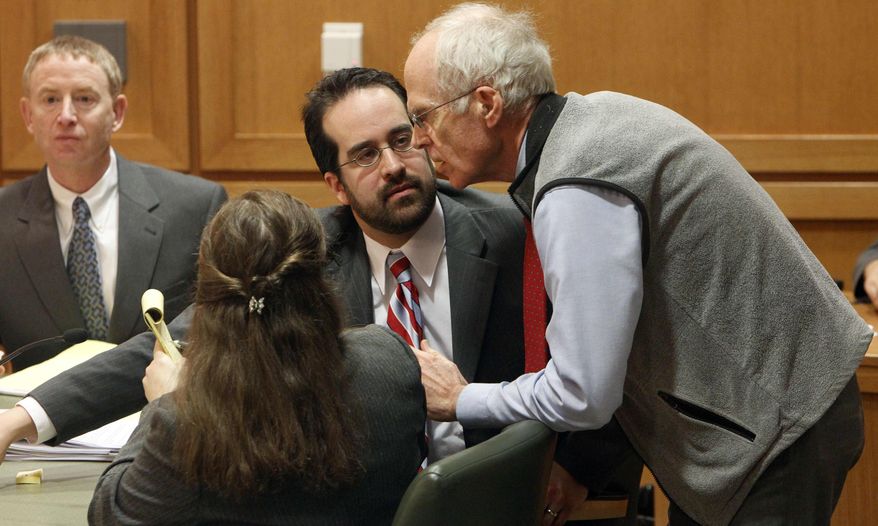 ** FILE ** Wisconson Secretary of State Douglas La Follette, right, confers with assistant attorneys general Maria Lazar, foreground, and Steven Kilpatrick, center, after a judge issued a temporary restraining order Friday, March 18, 2011, barring the publication of a controversial new law that would sharply curtail collective bargaining for public employees during a hearing in Dane County Court in Madison, Wis. (AP Photo/Pool, Mark Hoffman)