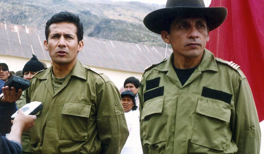 Ollanta Humala (left), a former Peruvian army officer and current presidential candidate, talks with reporters next to his brother, Antauro Humala, during their short-lived military rebellion in October 2000. (Associated Press)