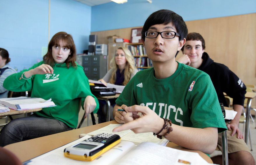 Chinese student Minzhe Zou answers a question in statistics class at Orono High School in Orono, Maine. (Associated Press)