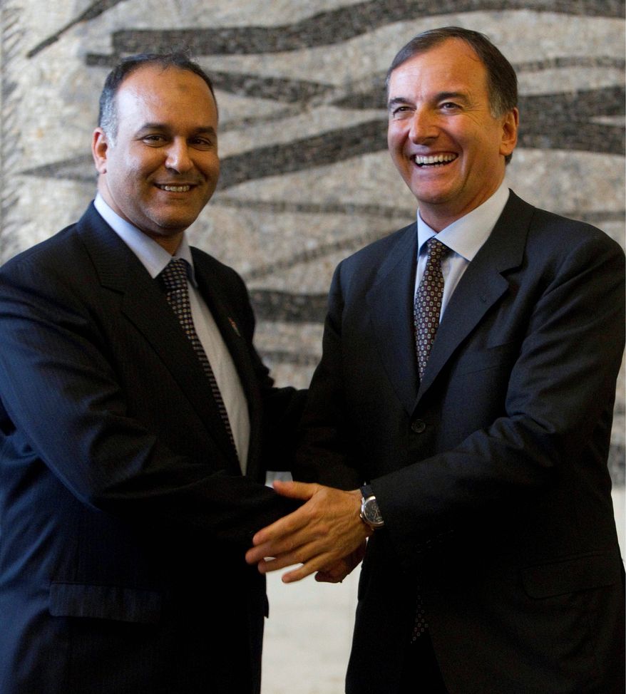 Libyan Interim National Transitional Council Foreign Minister Ali Al Issawi (left) and Italian Foreign Minister Franco Frattini show accord during a joint news conference in Rome on Monday. (Associated Press)