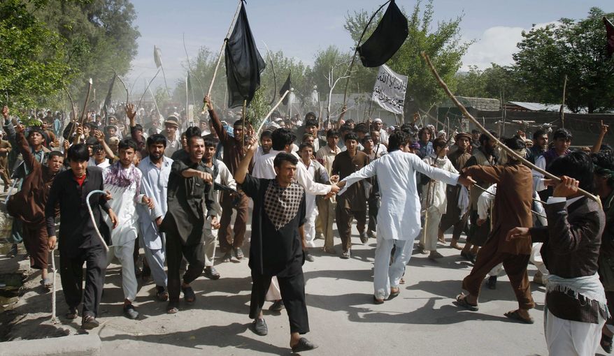 Protesters demonstrate in Laghman, Afghanistan, on Monday, April 4, 2011, against a Florida pastor's burning of the Quran, making four straight days of demonstrations, some deadly. (AP Photo/Rahmat Gul)