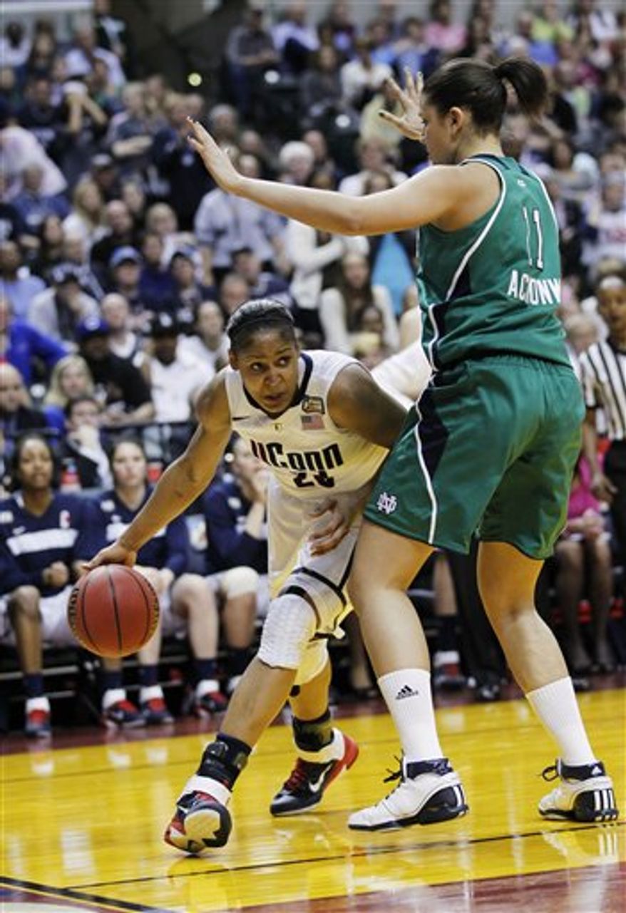 Connecticut's Maya Moore (23) reacts to a play against Notre Dame in the first half of a women's NCAA Final Four semifinal college basketball game in Indianapolis, Sunday, April 3, 2011. (AP Photo/Amy Sancetta)