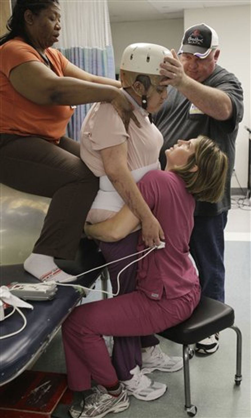 In this March 25, 2011 photo, a brain trauma patient at the TIRR rehabilitation facility in Houston has words of inspiration written on the cast on his knee. Rep. Gabrielle Giffords has been undergoing rehabilitation at the TIRR clinic. (AP Photo/Pat Sullivan)
