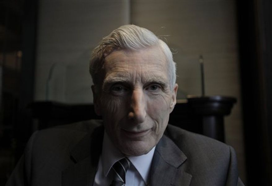 British astrophysicist Martin Rees, poses in central London,Tuesday April 5, 2011. Rees known for his theories on the origin and the destiny of the universe has been honored with one of the world's leading religion prizes. Martin Rees, a 68-year-old expert on the extreme physics of black holes and the Big Bang, is the recipient of the 2011 Templeton Prize, the John Templeton Foundation announced Wednesday April 6, 2011 . The 1 million pound ($1.6 million) award is among the world's most lucrative. (AP Photo/Lefteris Pitarakis)