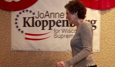 Wisconsin Supreme Court candidate JoAnne Kloppenburg, a state assistant attorney general, walks offstage after addressing supporters in Madison, Wis., on Wednesday, April 6, 2011, telling the audience the race is too close to call. Ms. Kloppenburg faces incumbent Justice David Prosser. (AP Photo/Andy Manis)