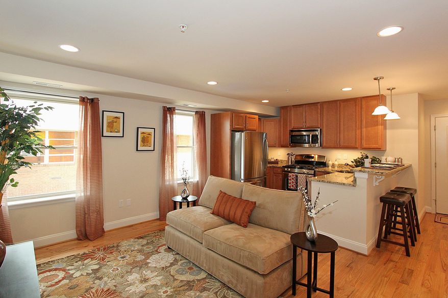 A typical home in the Christina has a living area open to the kitchen, which has stainless steel appliances and granite counters.