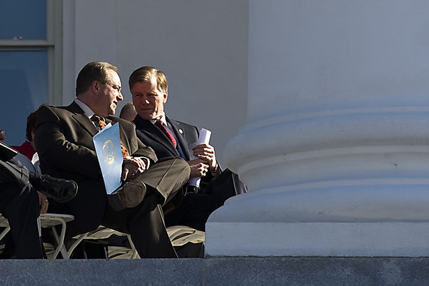 Lt. Gov. Bill Bolling, R-Va. left, talks with Gov. Bob McDonnell, R-Va., on the Statehouse steps during a Virginia Call to Prayer Day event, in Richmond, Va., Wednesday, April 6, 2011. (Drew Angerer/The Washington Times)