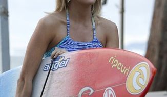 In this film publicity image released by TriStar Pictures, Carrie Underwood is shown in a scene from &quot;Soul Surfer.&quot; (AP Photo/TriStar Pictures, Mario Perez)