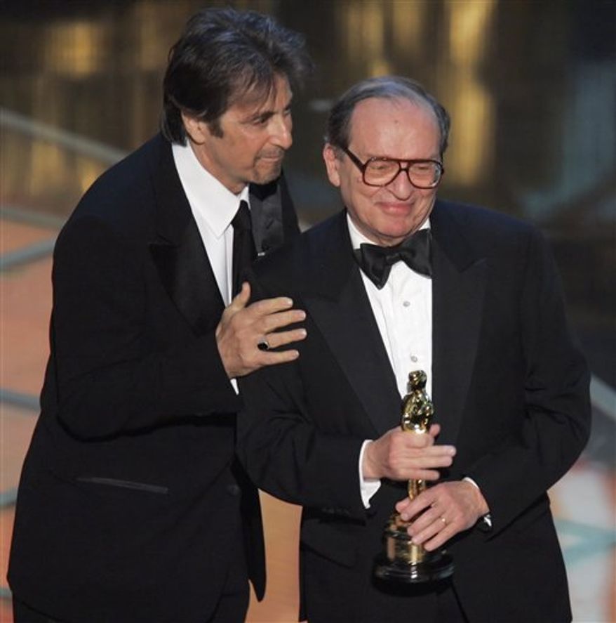 FILE - In this Sunday, Feb. 27, 2005 file picture, director Sidney Lumet, right, receives an honorary Oscar from the Academy of Motion Picture Arts and Sciences during the 77th Academy Awards telecast in Los Angeles, presented by actor Al Pacino. Lumet, the award-winning director of such acclaimed films as "Network," "Serpico," "Dog Day Afternoon" and "12 Angry Men," has died his family said Saturday, April 9, 2011. He was 86. (AP Photo/Mark J. Terrill)