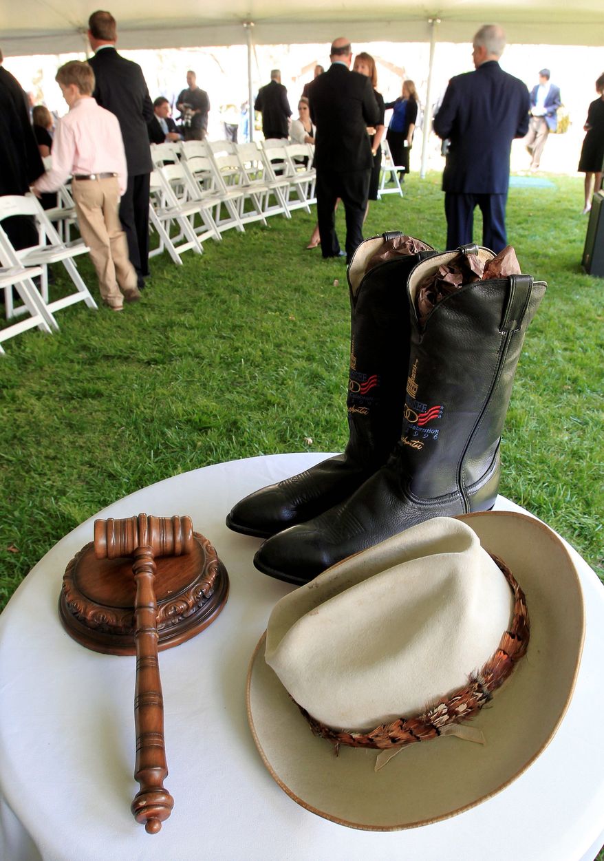 A hat, gavel and boots belonging to former Tennessee Gov. Ned McWherter are displayed before a memorial service Sunday at his home in Dresden, Tenn. Mr. McWherter, a two-term Democratic governor, died April 4. (Associated Press)