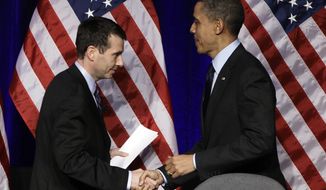** FILE ** President Obama is introduced by White House Senior Adviser David Plouffe before the president speaks at a Democratic National Committee event in Washington on Wednesday, March 16, 2011. (AP Photo)