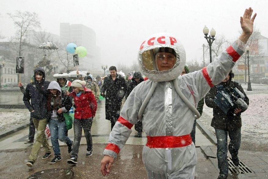 A flashmob rally in Moscow marks the 50th anniversary of cosmonaut Yuri Gagarin's first human spaceflight, a feat that remains a source of national pride. (Associated Press)