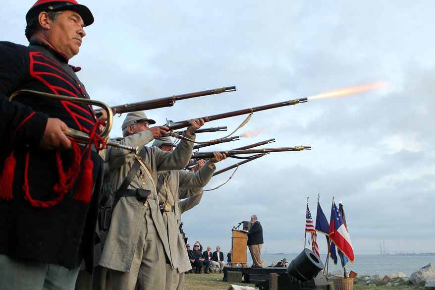 Civil War re-enactors fire a 21-gun salute at Fort Johnson, near Fort Sumter, in Charleston, S.C., on Tuesday, April 12, 2011, to commemorate the moment the first shots of the Civil War were fired 150 years ago. (AP Photo/Alice Keeney)