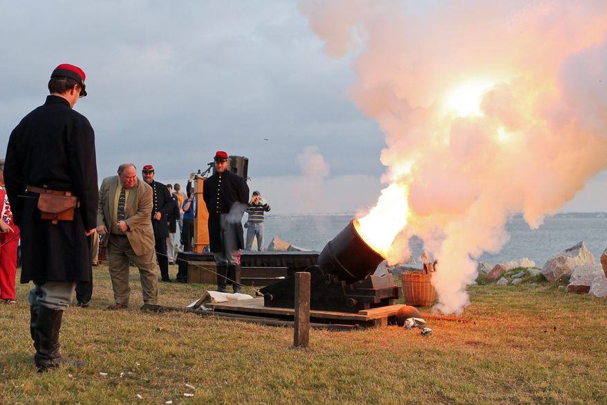 William Farley (second from left) fires a mortar at Fort Johnson, near Fort Sumter, in Charleston, S.C., on Tuesday, April 12, 2011, to commemorate the moment the first shots of the Civil War were fired 150 years ago. (AP Photo/Alice Keeney)