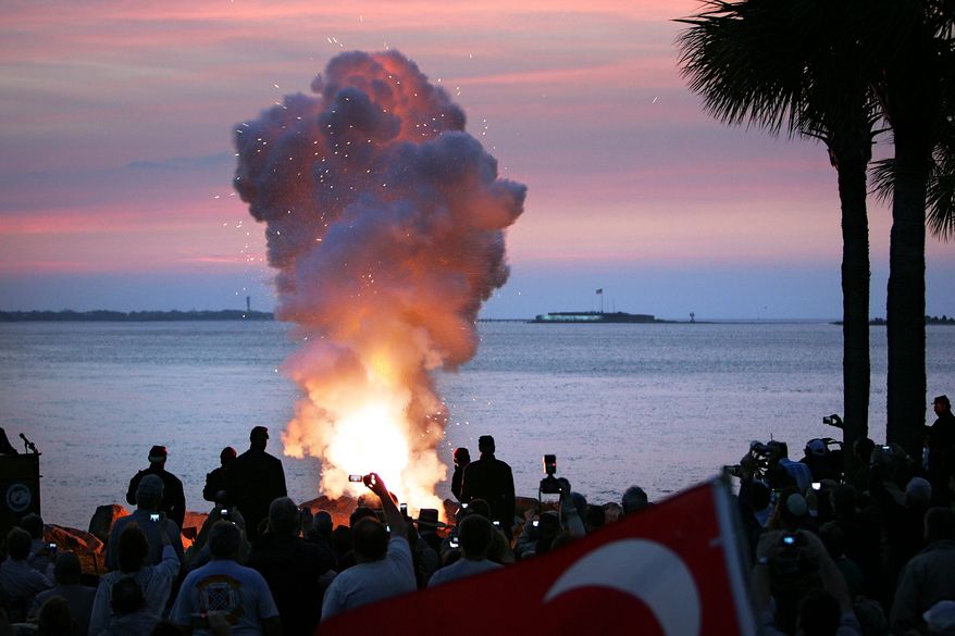 Cannon blasts from Fort Johnson across Charleston Harbor toward Fort Sumter at daybreak on Tuesday, April 12, 2011, in Charleston, S.C., signal the commemoration of the start of the Civil War 150 years ago. (AP Photo/Post and Courier, Wade Spees)