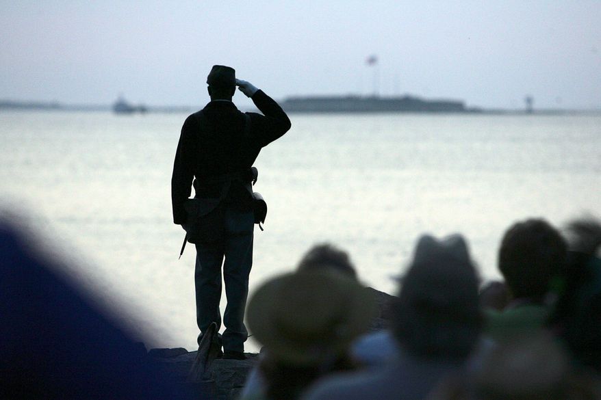 Ernest Parks, a re-enactor from Company I, Massachusetts 54th Regiment, salutes after tossing a wreath into Charleston Harbor toward Fort Sumter (in background) on Tuesday, April 12, 2011, during the commemoration of the 150th anniversary of the start of the Civil War. (AP Photo/Post and Courier, Wade Spees)