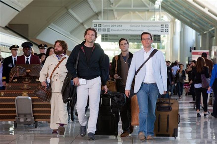 In this film publicity image released by Warner Bros. Pictures, from left, Zach Galifianakis, Bradley Cooper, Justin Bartha and Ed Helms are shown in a scene from, "The Hangover: Part II." (AP Photo/Warner Bros. Pictures, Melinda Sue Gordon)
