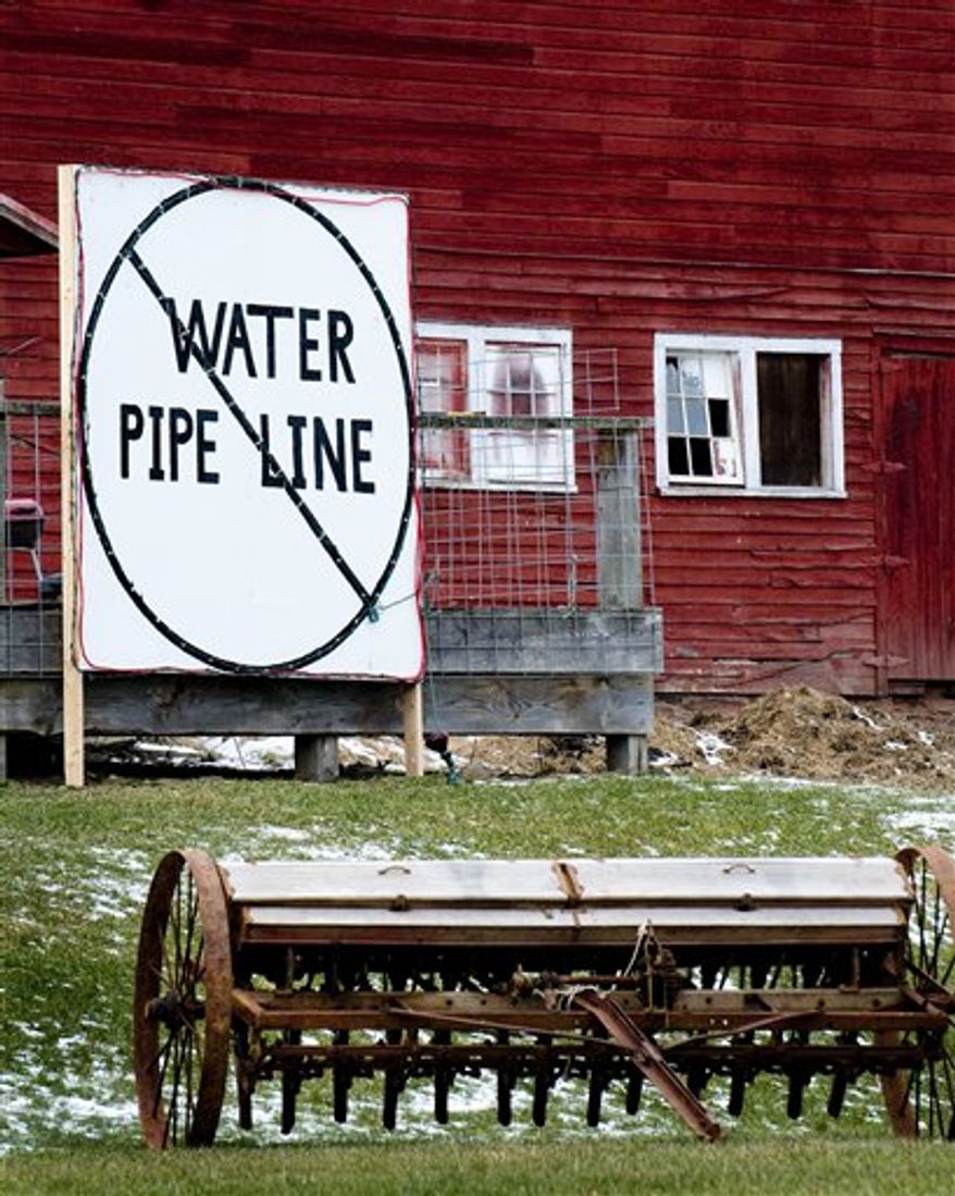 Scott Ely pauses at the construction site of his 7000 sq. ft. home on Carter Road in Dimock, Pa. in this photo taken Dec. 21, 2010. Residents in suburban Texas and rural Pennsylvania are living with the nastiness and rancor erupting in communities nationwide over the volatile issue of hydraulic fracturing, a form of gas drilling. (AP Photo/Ralph Wilson)