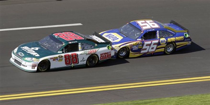 FILE - In this Feb. 20, 2011, file photo, Dale Earnhardt Jr. (88) and Martin Truex Jr. (56) team up during the Daytona 500 NASCAR auto race at Daytona International Speedway in Daytona Beach, Fla. Two-car tandems took over the season-opening Daytona 500, where the huge pack of cars broke apart as drivers realized that the fastest way around the superspeedway was with just one partner. Two drivers hooked up, took turns pushing each other to the front, then swapped the lead when their engines got too hot from all that pushing. Many fans fear a repeat of that racing at Talladega, and by every indication, that's exactly what they'll see. (AP Photo/Lynne Sladky, File)