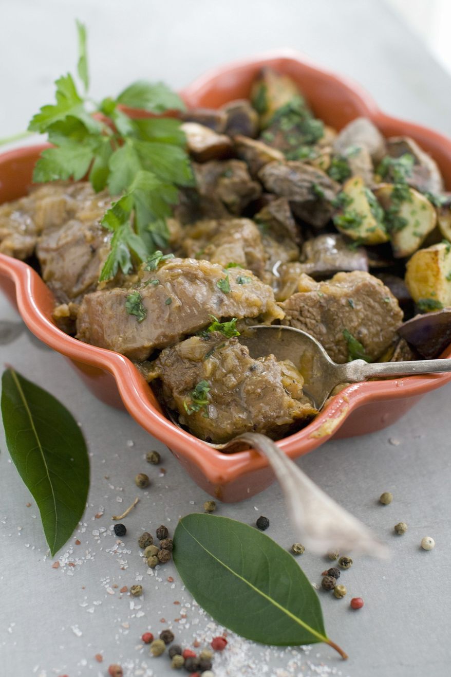 Beef cheek stew with cilantro and cumin is an Algerian-style main course for Passover Seder. The Jewish holiday presents an opportunity to bring together different elements of food from each family's history. (Associated Press)