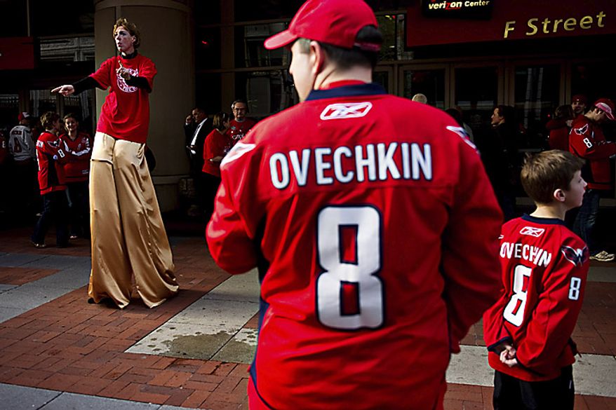 Mandy Dalton (left) dances for the crowd in front of the Verizon Center before a Washington Capitals playoff game against the New York Rangers in Washington on Wednesday, April 13, 2011. (Drew Angerer/The Washington Times)