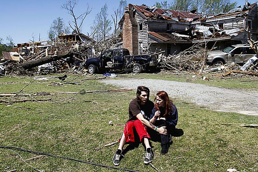 Nathaniel Ramey (left) comforts Megan Hurst at her grandmother's house in Askewville, N.C., on Sunday, April 17, 2011, after a tornado struck Saturday. (AP Photo/Jim R. Bounds)