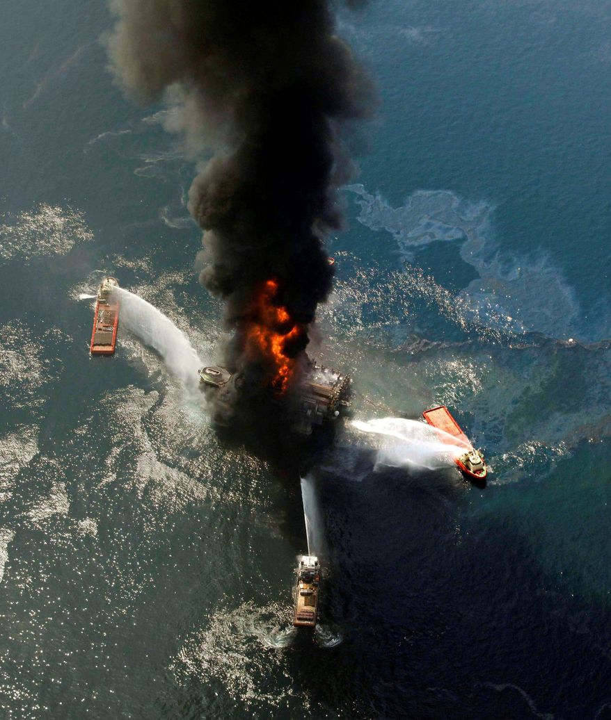 The Deepwater Horizon oil rig burns after the April 20, 2010, explosion in the Gulf of Mexico that killed 11 men. (Associated Press)