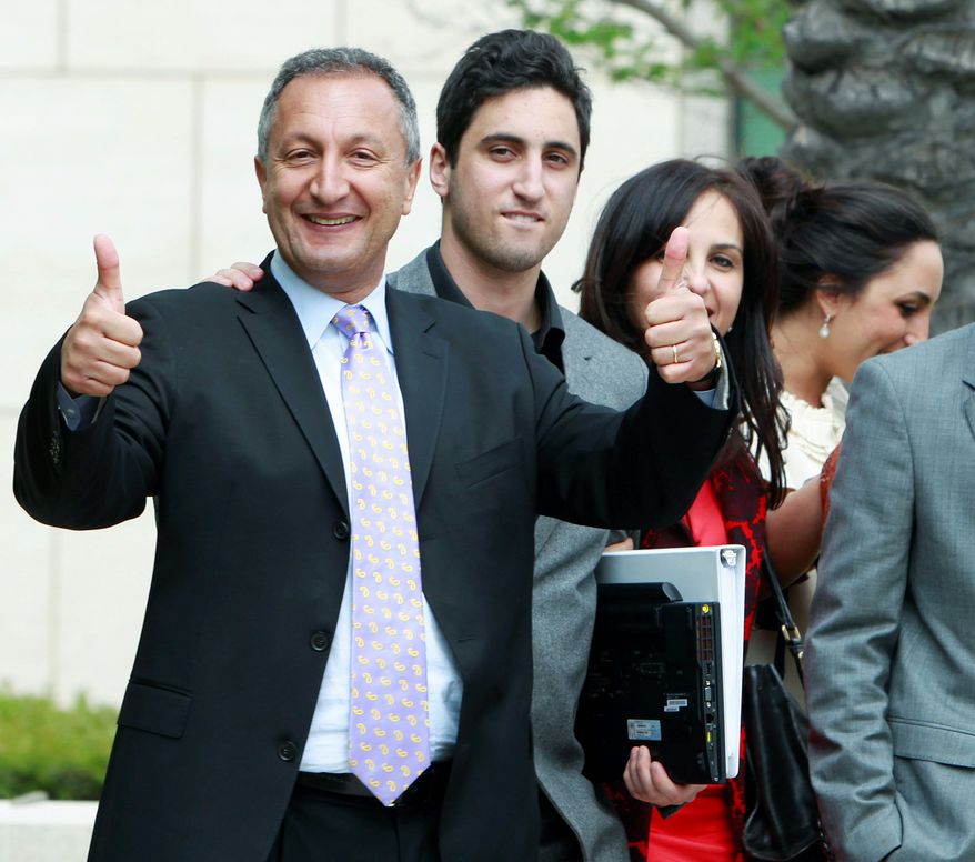 MGA Chief Executive Isaac Larian celebrates a victory over Mattel Inc. outside of federal court in Santa Ana, Calif., on Thursday. Mattel had contended that Bratz designer Carter Bryant created the line while employed by Mattel. (Associated Press)