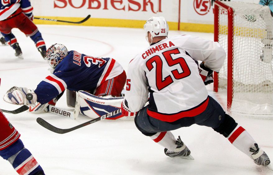 Jason Chimera prepared to score the Capitals&#39; game-winning goal in the second overtime Wednesday night after New York Rangers goalie Henrik Lundqvist couldn&#39;t corral the puck. Game of the Eastern Conference quarterfinal series is Saturday at Verizon Center. (Associated Press)