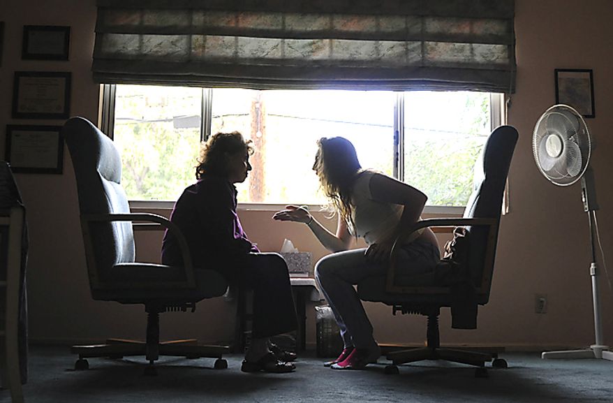 Children of the Night resident "Jane," 17, gets emotional with Family Therapist Dr. Helaine Harris during a therapy session in Harris' home in Los Angeles, Thursday, April 21, 2011. "Jane," sees Harris every week to help her manage her emotions from her troubled past. (Garrett Cheen/Special to The Washington Times)