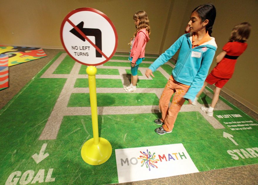 Children use math to figure out a maze at the Museum of Nature & Science at Fair Park in Dallas. Glen Whitney, a former hedge-fund quantitative analyst, is planning to include such colorful exhibits for MoMath, a museum dedicated to the "beauty" of math, scheduled to open next year in New York. (Associated Press)