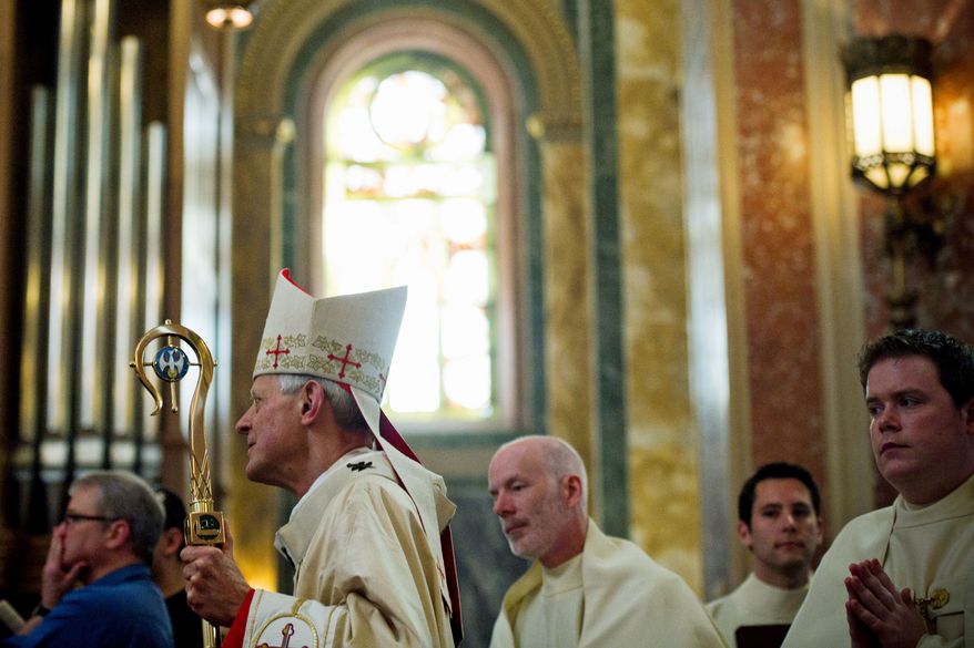 Cardinal Donald W. Wuerl, the archbishop of Washington, urged Catholics to rejuvenate their faith and share it with others. "We are not just bystanders. We're invited to share in Christ's new life," he said. (Drew Angerer/The Washington Times)