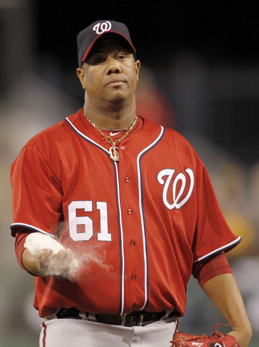 Washington Nationals starting pitcher Livan Hernandez hits the rosin bag after giving up a double to Pittsburgh Pirates' Garrett Jones that drove in a run in the Pirates 5-run first inning of the baseball game, Saturday, April 23, 2011, in Pittsburgh. (AP Photo/Keith Srakocic)