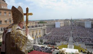 In this photo provided by the Vatican newspaper L&#39;Osservatore Romano, Pope Benedict XVI holds his pastoral staff Sunday during the &quot;Urbi et Orbi&quot; (Latin for to the City and to the World) message from the balcony of St. Peter&#39;s Basilica at the end of the Easter Mass in St. Peter&#39;s Square at the Vatican. Benedict XVI urged an end to fighting in Libya, using his Easter Sunday message to call for diplomacy and peace in the Middle East. (Associated Press/L&#39;Osservatore Romano)