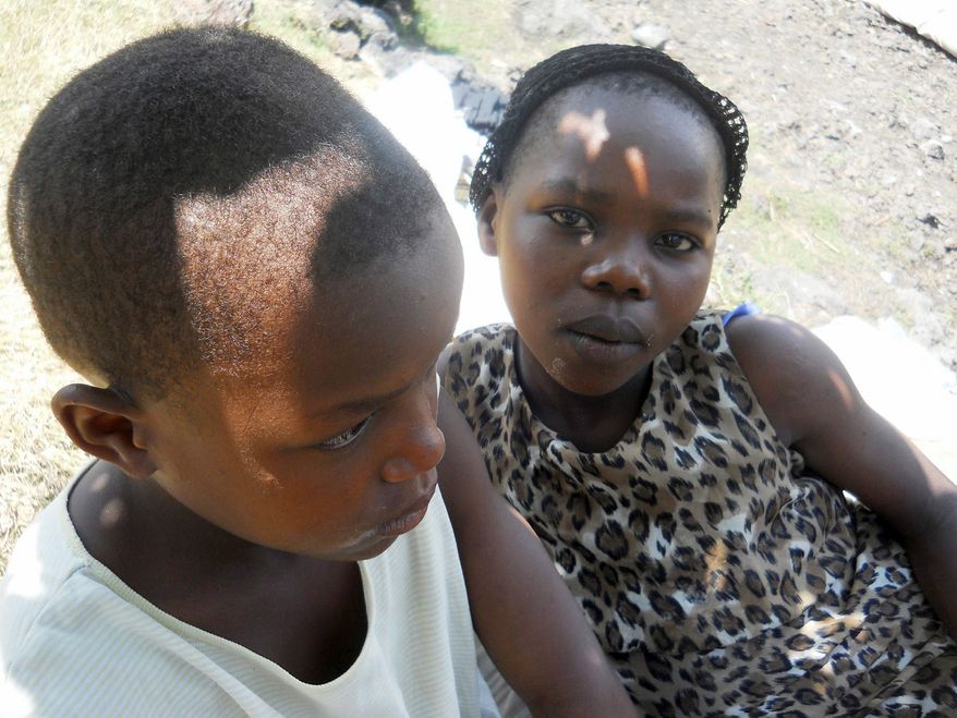 HEATHER MURDOCK/SPECIAL TO THE WASHINGTON TIMES
Donata and Vestina are 11- and 9-year-old sisters who were raped by a cowherd after being grabbed while walking home from the market. Rape in Congo is widespread and rarely prosecuted. The United Nations Children's Fund says it treated 16,000 rape victims there last year; about half were children.