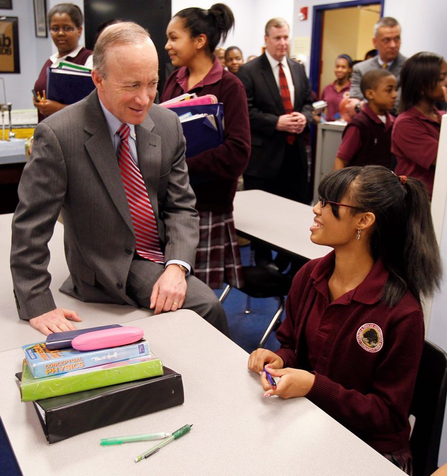 Associated Press
Indiana Gov. Mitch Daniels chats with student Cree DeDeaux, 14, during a tour of the Charles A. Tindley Accelerated School in Indianapolis on April 15. Indiana on Wednesday passed the largest school-voucher bill in the nation's history. Mr. Daniels is expected to sign the measure into law.