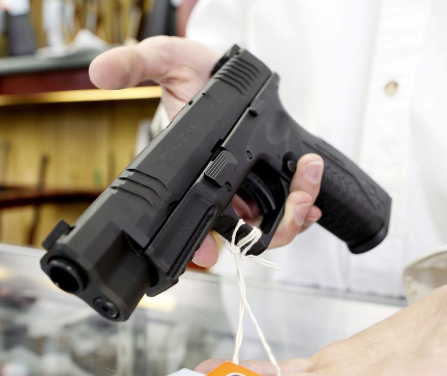 **FILE** A popular semiautomatic pistol manufactured by Springfield Armory at G. A. T. Guns in Dundee, Illinois