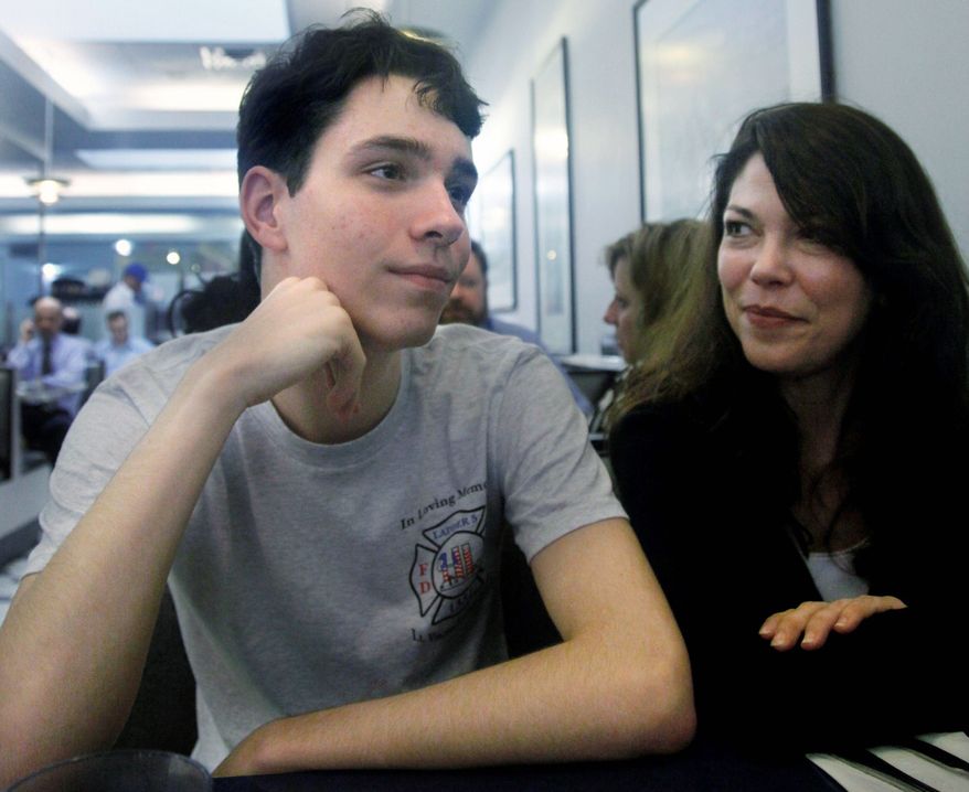 ASSOCIATED PRESS
"It's been healing, for myself as well as others," said Brook Peters, 14, with his mother, Michelle Peters, about the Sept. 11 documentary he put together. "I definitely had a very bad experience that day." He was in kindergarten in New York City at the time.