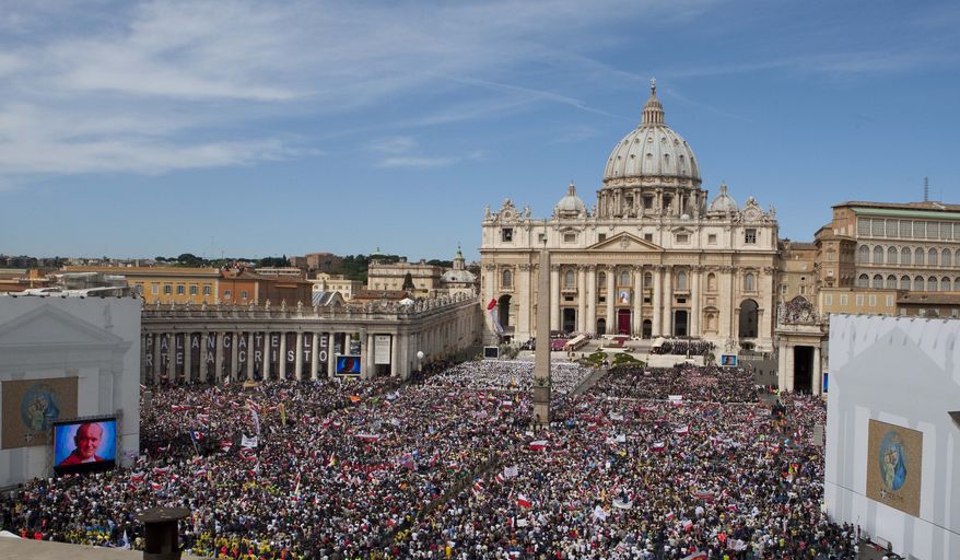 Pilgrims pack St. Peter's Square at the Vatican on Sunday, May 1, 2011, as Pope Benedict XVI beatifies his predecessor, Pope John Paul II. (AP Photo/Antonio Calanni)