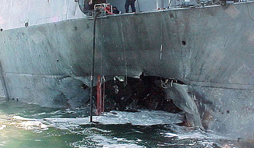 This Oct. 12, 2000, photo provided by the U.S. Navy shows damage sustained by the USS Cole after a suspected terrorist bomb exploded during a refueling operation in the port of Aden, Yemen. (AP Photo/U.S. Navy) **FILE**