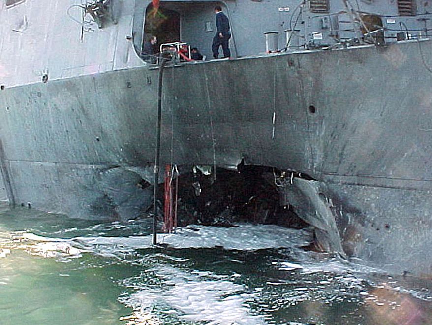 This Oct. 12, 2000, photo provided by the U.S. Navy shows damage sustained by the USS Cole after a suspected terrorist bomb exploded during a refueling operation in the port of Aden, Yemen. (AP Photo/U.S. Navy) **FILE**